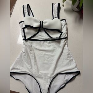 White, one piece swimming suit with bow
